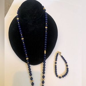 Blue and Gold beaded necklace 27” long with matching bracelet. Bracelet tag AVON